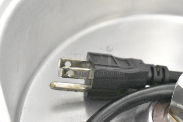 Close-up of Robot Coupe CL 50 food processor's power plug, showing the standard three-prong design.