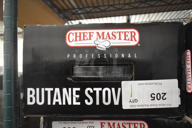 Brand new Chef Master stainless steel butane stove cover, 7 3/16" x 14 1/2" x 12", with some scratches and dents.