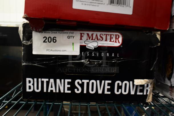 Chef Master stainless steel butane stove cover, 7 3/16" x 14 1/2" x 12", new with box scratches. Auction label visible.