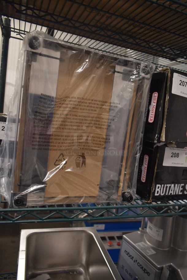 Brand new Chef Master 90217 stainless steel butane stove cover, 7 3/16" x 14 1/2" x 12". Scratch and dent condition.