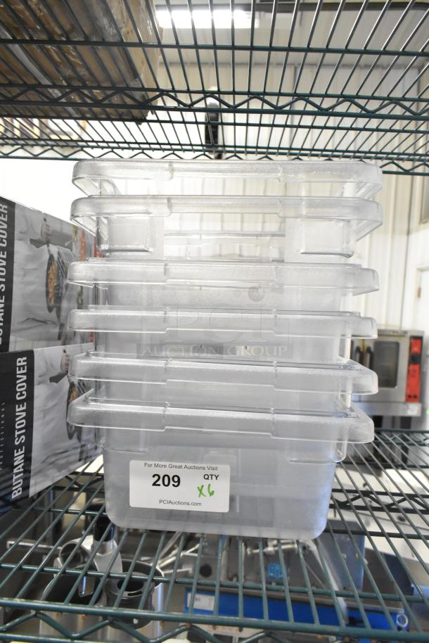 Six brand new clear poly bins with minor scratches, stacked on a shelf. Label reads “209 QTY x6.”