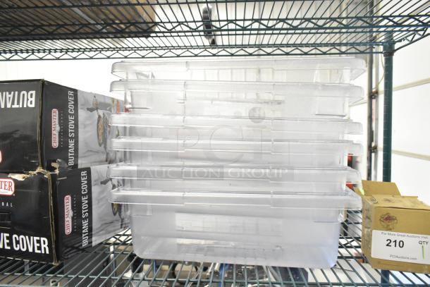 Six brand new clear poly bins with minor scratches; stacked on shelf. Rectangular shape. Auction tag reads "210 QTY."