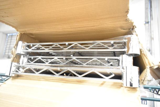 Brand new 460EC chrome finish wire shelves, slight scratches and dents, shown in original box.