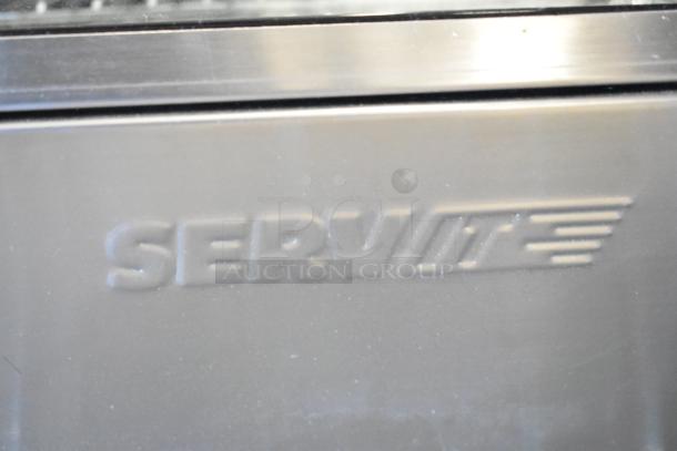 ServIt 423HDM26SA logo on metal surface, related to the 26" heated display case with minor scratches.
