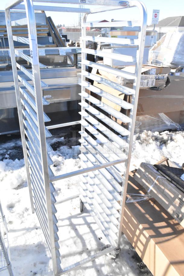 Commercial pan transport rack with 18 slots, on durable casters, in good condition. Ideal for kitchen use.