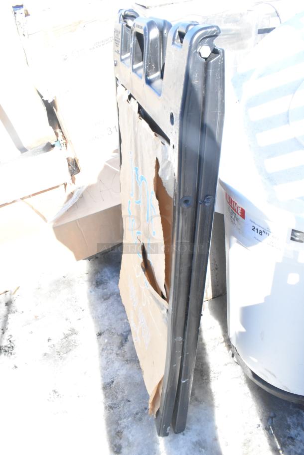 Black Poly A Frame Sidewalk Sign, showing wear, made of durable black plastic, ideal for outdoor advertising.