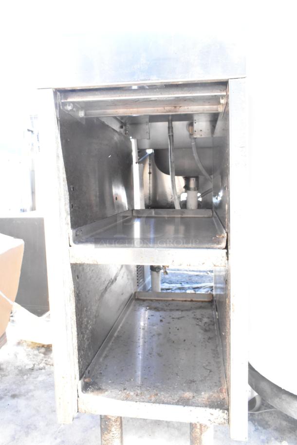 Commercial metal drain board with two under shelves, showing signs of wear and rust. Ideal for restaurant use.