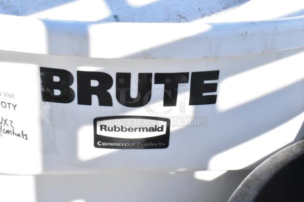 Rubbermaid Brute trash can, visible branding. Includes contents. Bid doubles for two units. Good condition.