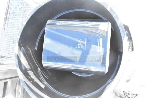 Two poly trash cans, one containing a blue Kimberly-Clark paper towel dispenser. Condition: used. "Pull Forward" label visible.