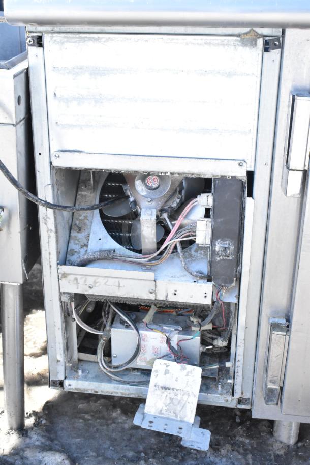 Commercial undercounter 2-door cooler with open back panel showing internal components. Moderate wear, needs maintenance.