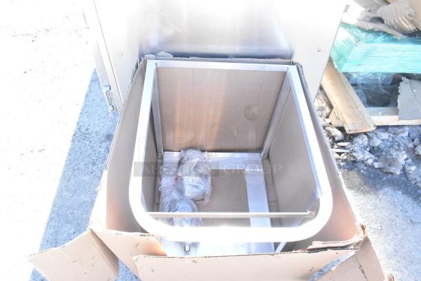 Brand new scratch and dent rack in open box. Visible metal frame, protective wrap on components, minor packaging wear.