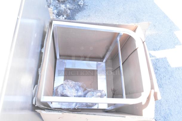 Brand new scratch and dent rack in original packaging, showing metal frame and protective wrapping. Some dents visible.