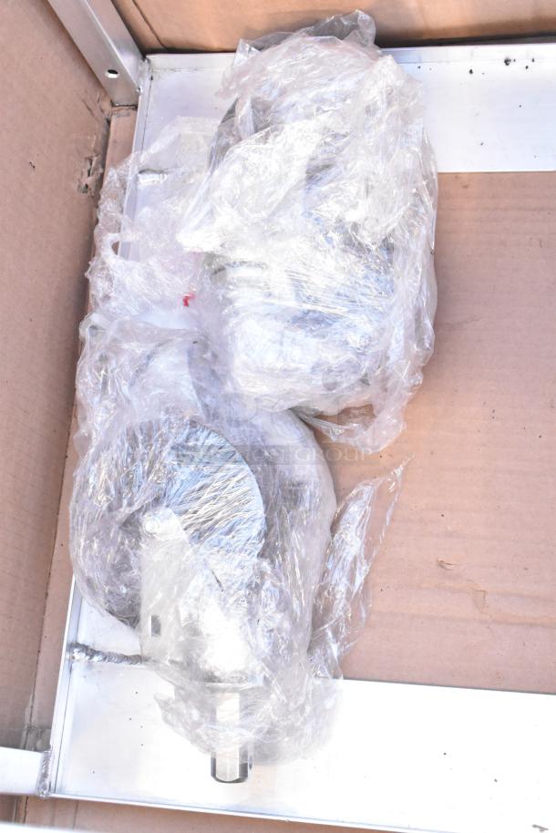 Brand new scratch and dent rack wrapped in plastic packaging, visible in a cardboard box.