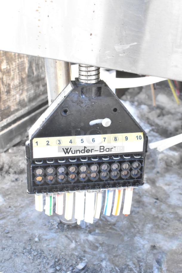 Commercial ice bin with Wunderbar soda gun, featuring 10 buttons and multiple colored hoses, shown in used condition.