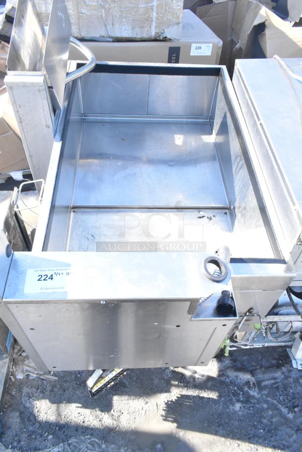 Commercial stainless steel ice bin with attached Wunderbar soda gun, visible signs of use, label: item 224.