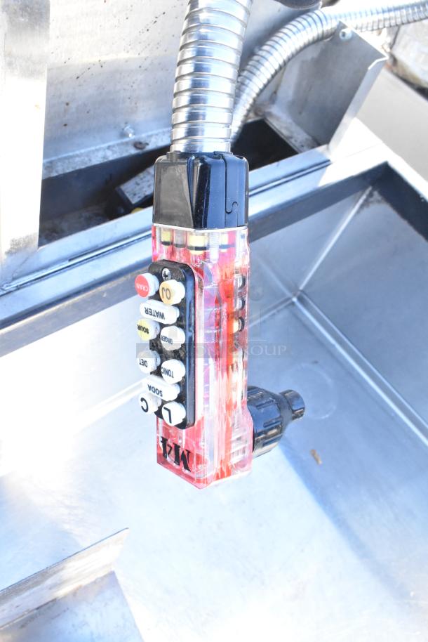 Commercial ice bin with attached Wunderbar soda gun, featuring multiple drink options. Stainless steel, used condition.