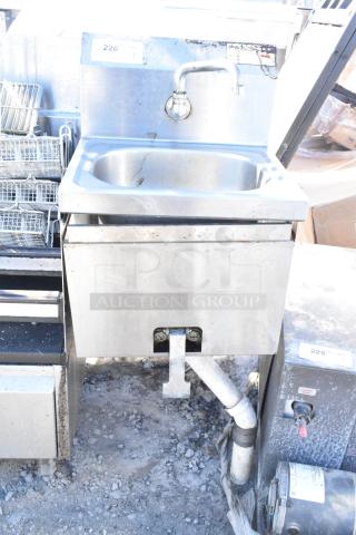 Krowne single bay sink, stainless steel, wall-mounted with faucet and visible scuffs, suitable for commercial use.