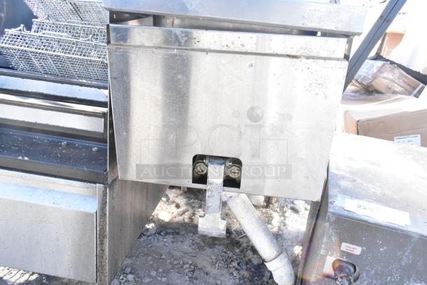 Krowne Single Bay Sink, stainless steel, used condition with visible wear. Includes mounting hardware and plumbing connections.