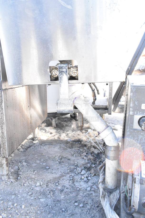 Krowne single bay sink with visible plumbing, metal construction, and industrial-grade fixtures, showing outdoor wear.