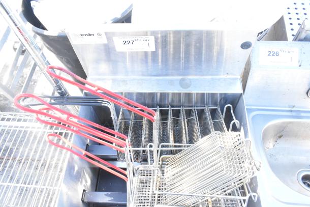 Glastender LDA-18S 4 Level Raised Liquor Display with fry baskets, stainless steel, includes red-handled baskets, good condition.