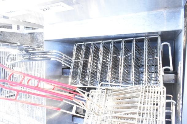 Glastender LDA-18S 4 Level Raised Liquor Display with fry baskets, stainless steel, excellent condition.