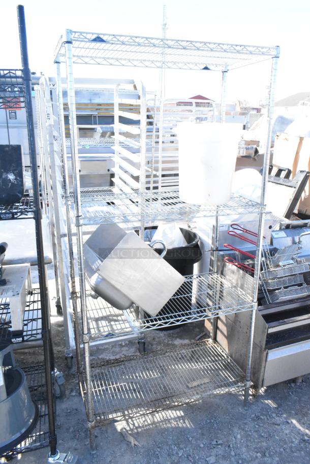 Chrome finish 4-tier wire shelving unit with assorted contents including a sink; buyer dismantles; freight required.