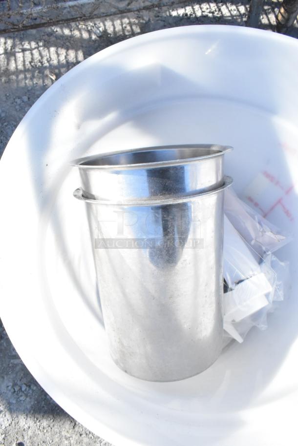 Chrome finish four-tier wire shelving unit with contents, including a sink. Buyer must dismantle. Consider freight charges.