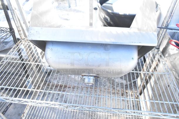 Chrome finish 4-tier wire shelving unit holding a metal sink, which needs dismantling by the buyer; shipping not provided.