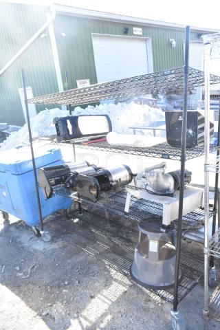 Black finish 4-tier wire shelving unit with napkin dispensers, Uline brand. Requires self-dismantling. Consider freight charges.