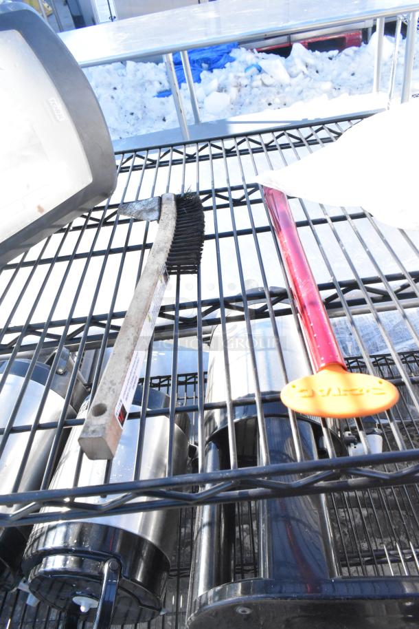 Black finish 4-tier wire shelving unit with napkin dispensers, includes tools and accessories on shelves. Buyer must dismantle.