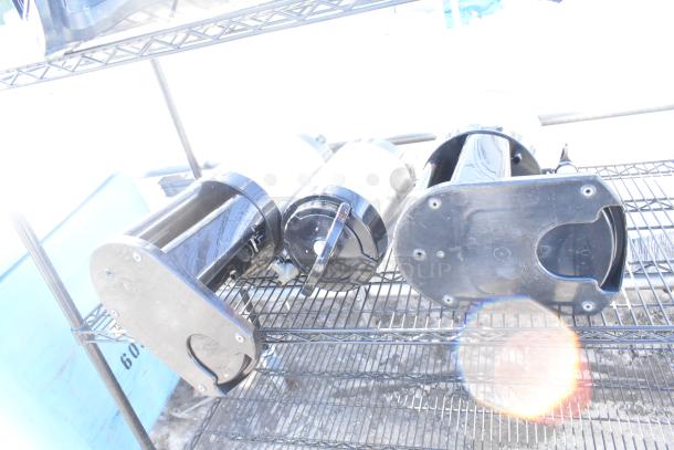 Black 4-tier wire shelving unit with attached napkin dispensers. User dismantle required. Consider freight charges.