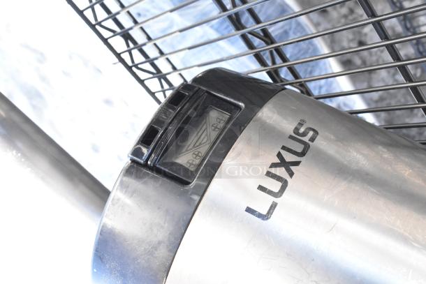 Black wire shelving unit with four tiers; includes napkin dispensers. Requires dismantling for shipping. Visible Luxus branding.