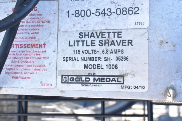 Black wire shelving unit, four-tier, with built-in napkin dispensers. Buyer must dismantle. Consider freight costs.