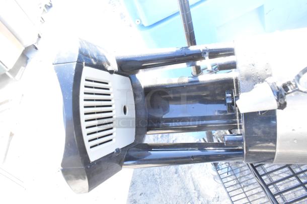 Black finish 4-tier wire shelving unit with napkin dispensers. Requires user dismantling for transport.