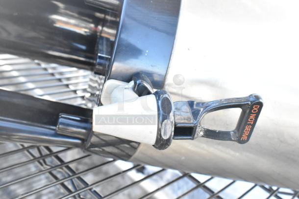 Black finish 4-tier wire shelving unit with napkin dispensers. Features "Do Not Serve" handle. Buyer must dismantle.