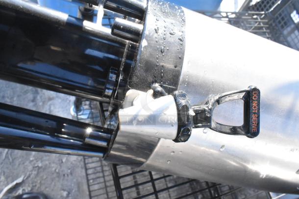 Black finish 4-tier wire shelving unit with napkin dispensers, featuring "Do Not Serve" label on spout. Buyer must dismantle.