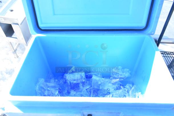 Thermosafe HRMP3-LC blue poly cart with open lid, filled with plastic bags, on commercial casters.