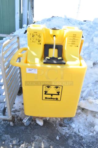Bradley S19-921 Gravity Feed Eye Wash, yellow, mobile with wheels, clear instructions on unit, good condition.