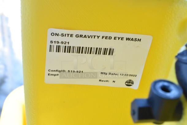 Bradley S19-921 Gravity Feed Eye Wash, yellow, manufactured 12/22/2022. On-site use, with product label displayed.