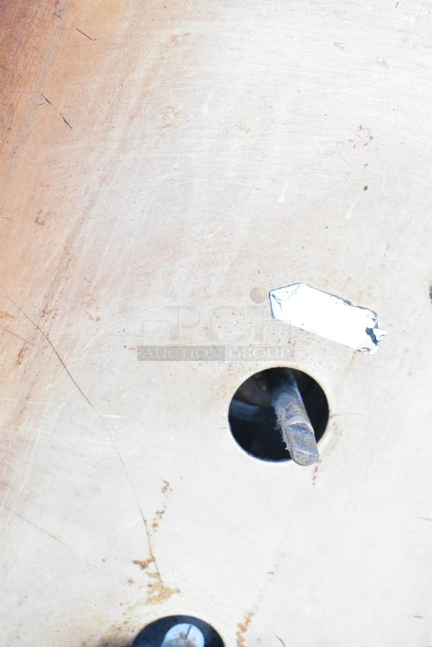 Two Montague 24P-2 natural gas single deck pizza ovens. Used, stainless steel, commercial-grade. Front panel detail shown.