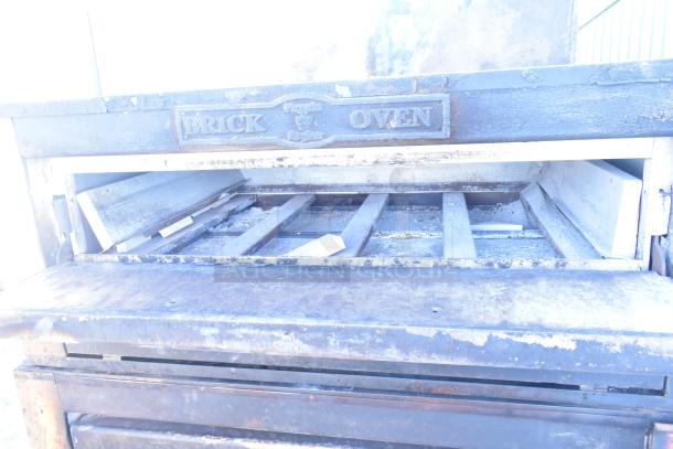 Montague 24P-2 commercial pizza oven, natural gas, single deck, visible "Brick Oven" label, used condition.