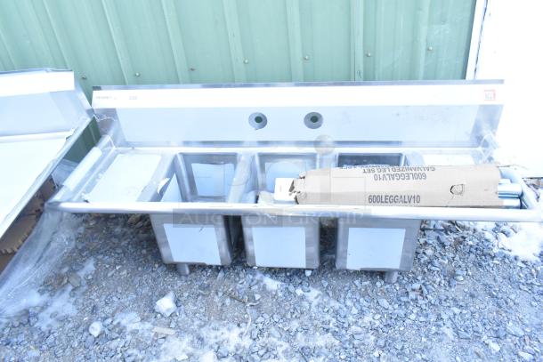 BRAND NEW Regency 600S31014212 stainless steel three-compartment commercial sink with galvanized steel legs, 2 drainboards.