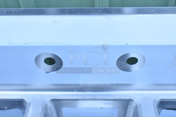 Brand new Regency 600S31014212 stainless steel 3-compartment sink, 16-gauge, galvanized legs, 2 drainboards, slight scratches.