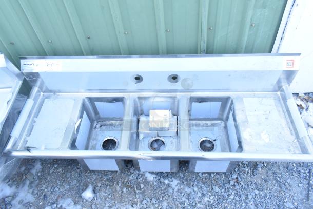 Brand new Regency 600S31014212 sink, 16-gauge stainless steel, three compartments, galvanized legs, 2 drainboards, tagged.