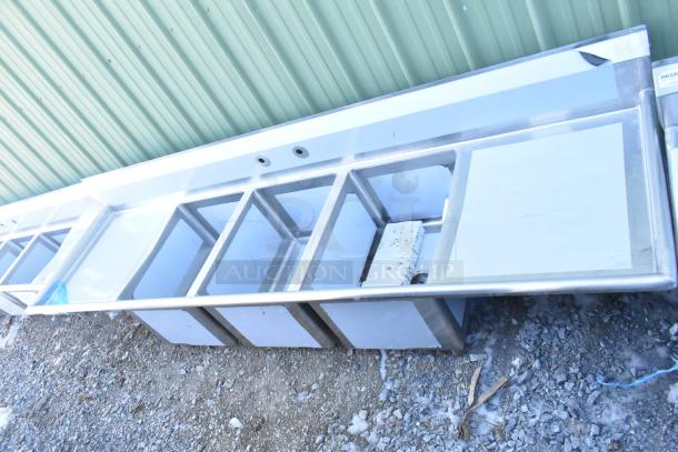 Three-compartment Regency 600S31824224 stainless steel sink with 2 drainboards, scratch and dent, no legs.