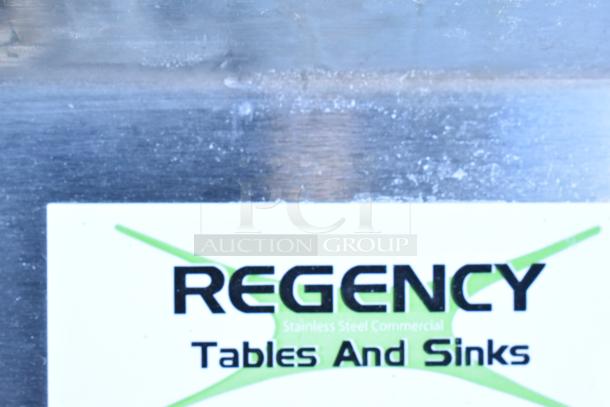 Regency 600S31824224 stainless steel sink, brand new, three compartments, two drainboards, scratch and dent, no legs.