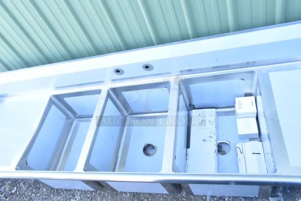 BRAND NEW SCRATCH AND DENT! Regency 16-gauge stainless steel three-compartment commercial sink with two drainboards, no legs.