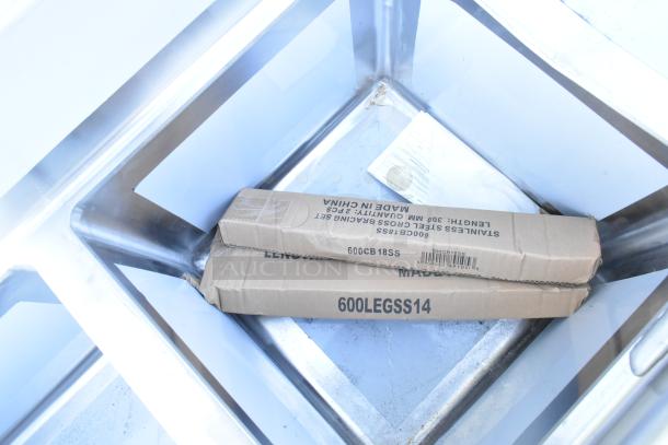 Brand new Regency 600S31818218 stainless steel 3-compartment sink, 16 gauge, with cross bracing and two drainboards. Includes boxed cross bracing set marked "600CB18SS."