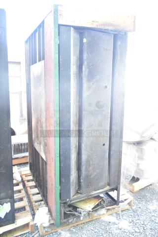 Montague 24P-2 gas pizza oven, single deck, industrial use, visible wear, rust, sits on a pallet, Montague branding.