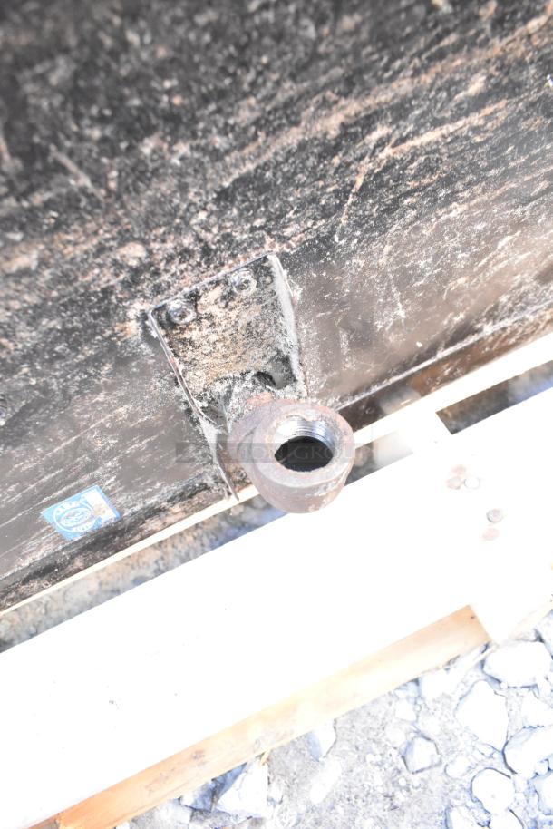 Montague 24P-2 commercial pizza oven connector detail, showing natural gas inlet, in fair condition on wooden pallet.